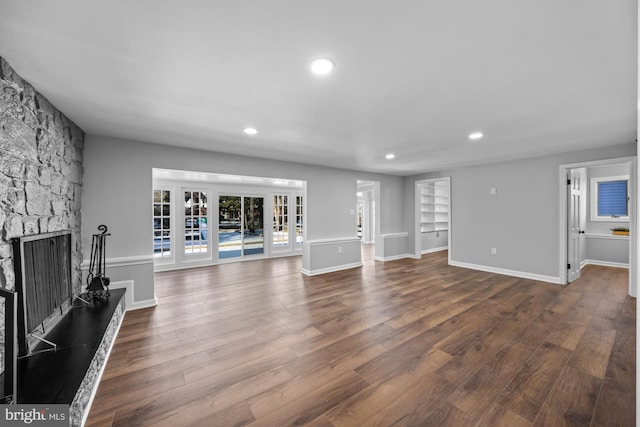 living room featuring dark hardwood / wood-style floors and a fireplace