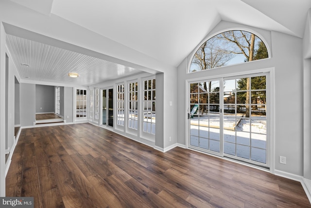 unfurnished living room with dark hardwood / wood-style flooring