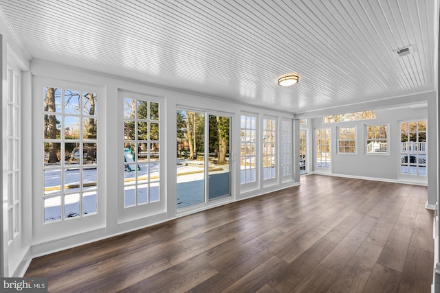 unfurnished sunroom with wood ceiling and a wealth of natural light