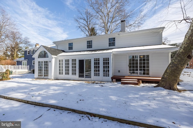 view of snow covered property