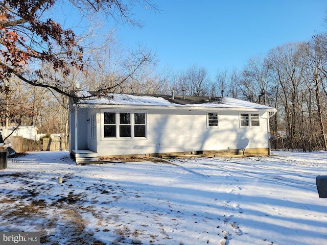 view of snow covered house