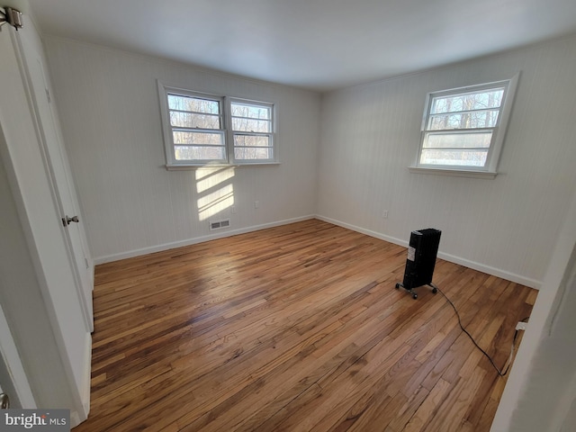 unfurnished room with light hardwood / wood-style floors