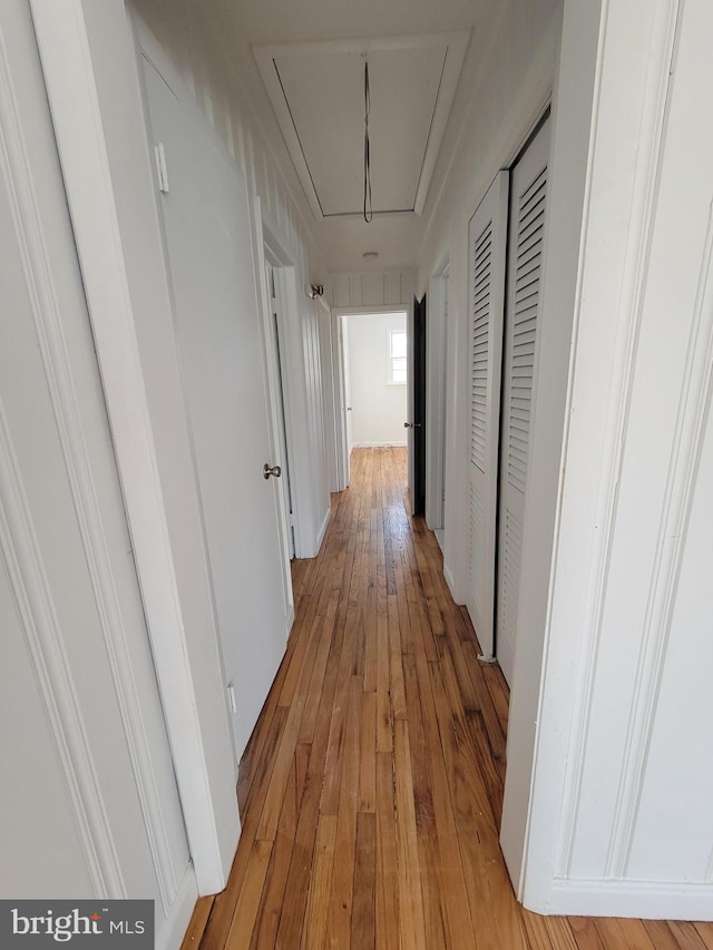 corridor with light wood-type flooring