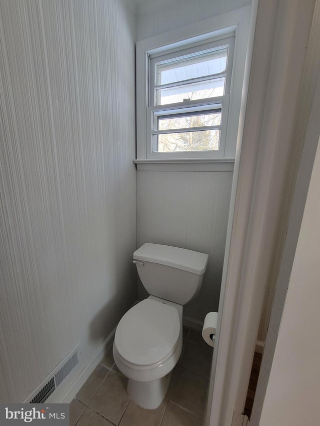 bathroom with tile patterned floors and toilet