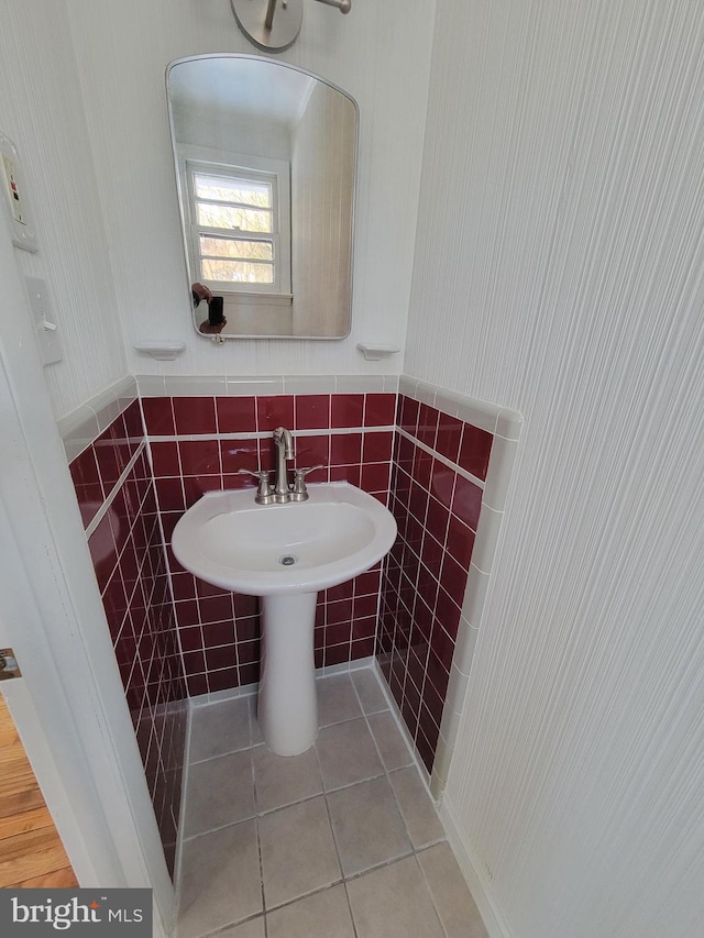 bathroom featuring tile patterned flooring and tile walls