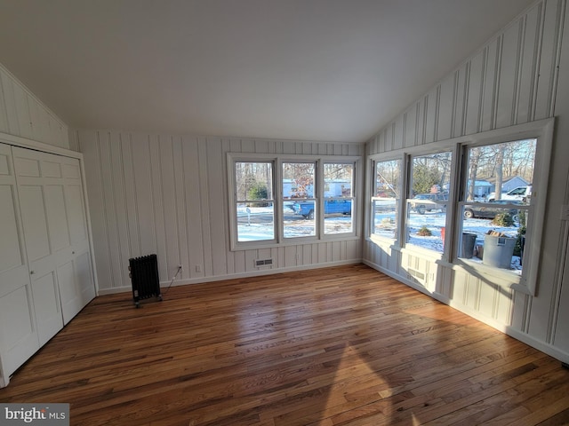 unfurnished sunroom with lofted ceiling