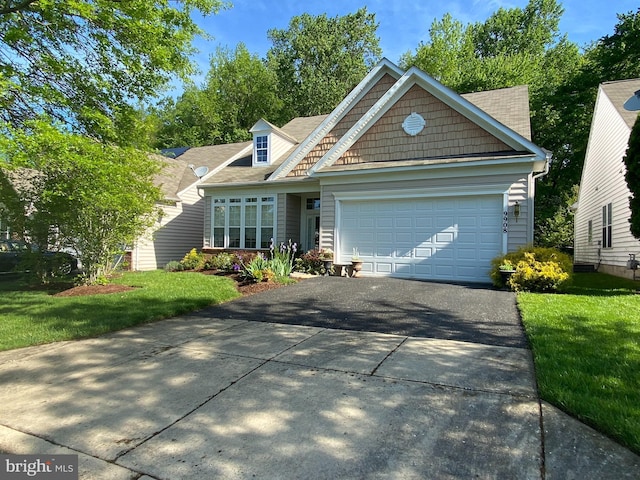 view of front of home featuring a garage and a front yard