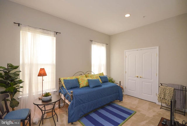 bedroom with light colored carpet