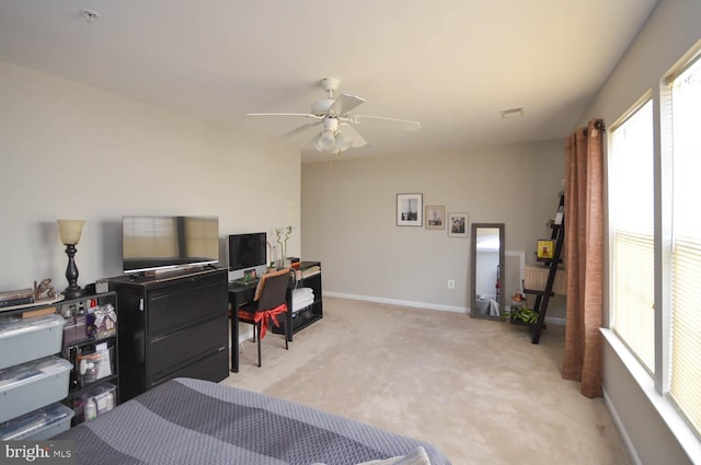 bedroom featuring ceiling fan and light carpet