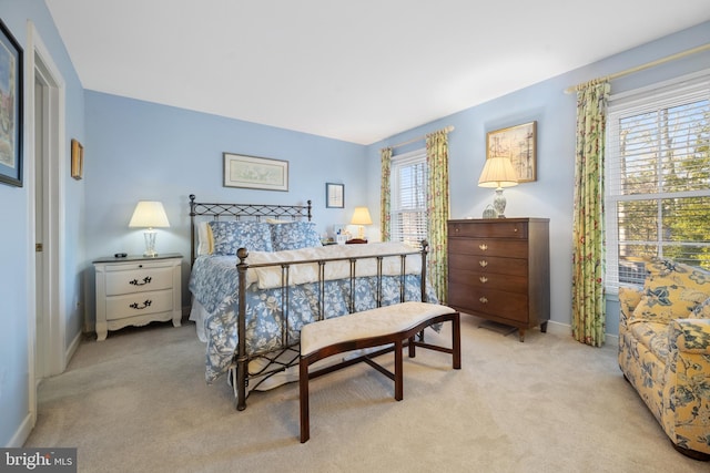 bedroom with light colored carpet