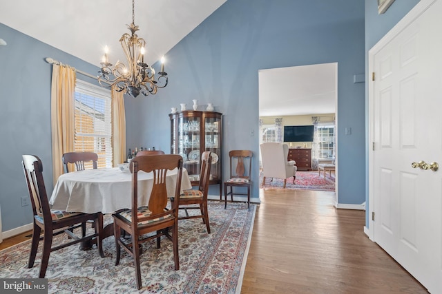 dining area featuring an inviting chandelier and wood-type flooring