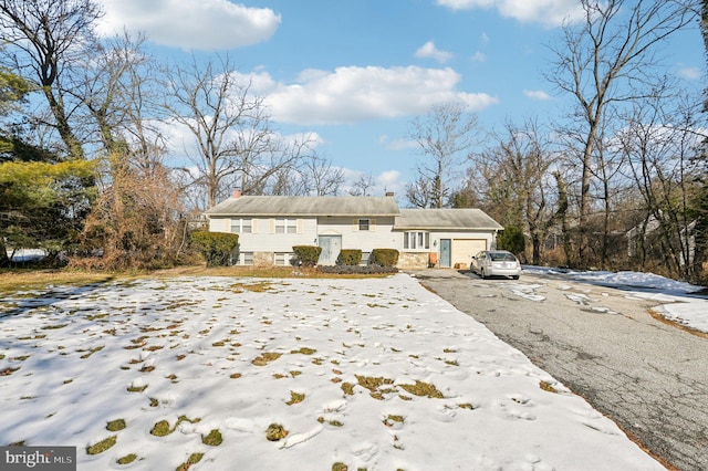 216 Morris Ave, Lutherville Timonium, MD 21093 - view of snow covered exterior featuring a garage