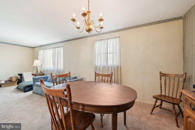 dining space with a notable chandelier and carpet flooring