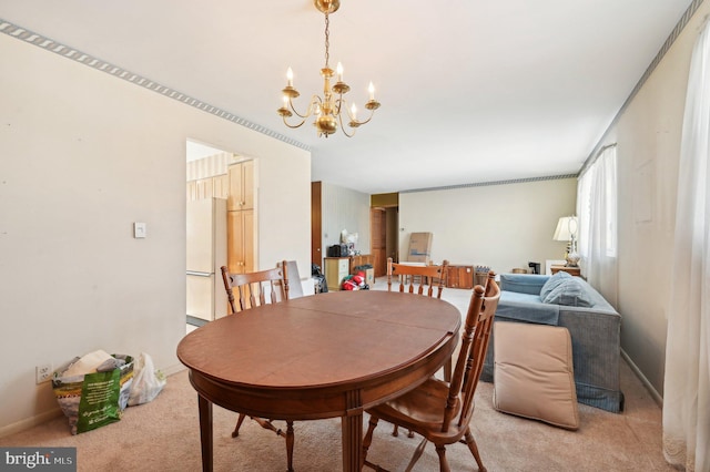 carpeted dining room with an inviting chandelier