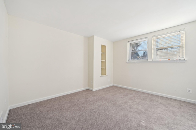 empty room with light colored carpet