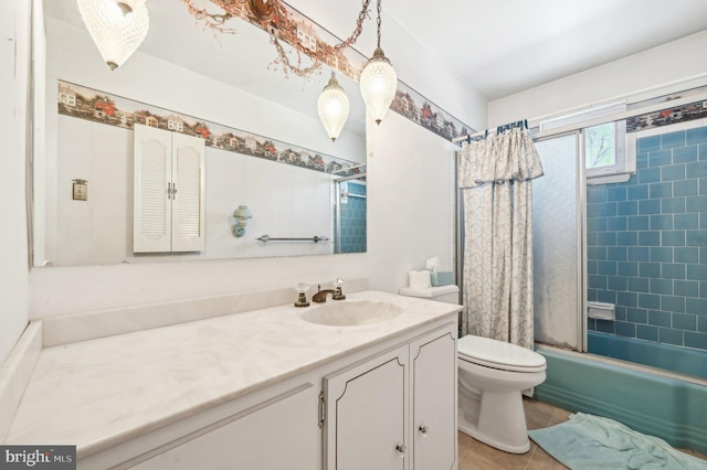 full bathroom with vanity, toilet, tile patterned flooring, and shower / bath combo