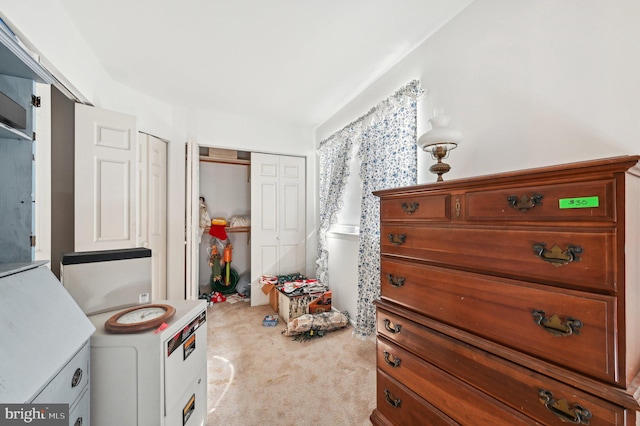 carpeted bedroom with a closet