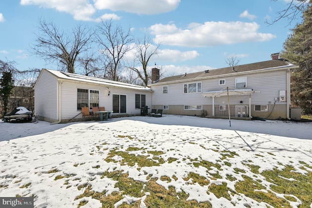 view of snow covered house