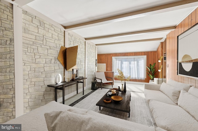 living room featuring wooden walls and lofted ceiling with beams