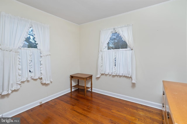 empty room with dark wood-type flooring and a healthy amount of sunlight