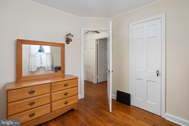 bedroom featuring dark hardwood / wood-style flooring