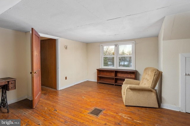 sitting room with light wood-type flooring