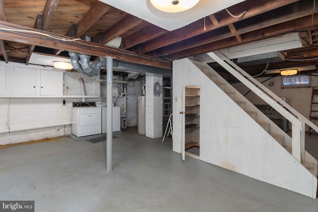 basement with separate washer and dryer and water heater