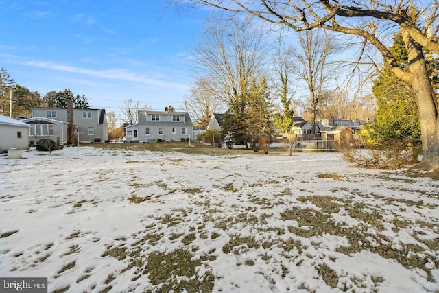 view of yard covered in snow