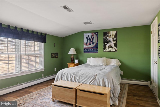 bedroom with a baseboard radiator, dark hardwood / wood-style floors, and vaulted ceiling