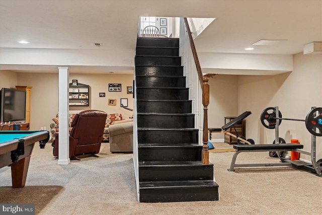 staircase featuring carpet floors