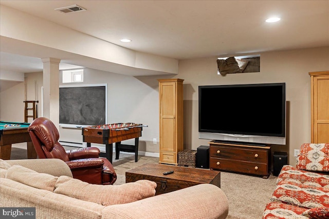 living room with light carpet and baseboard heating