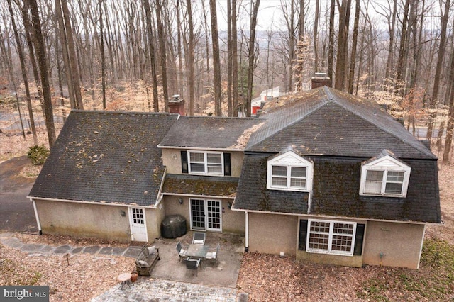 rear view of property with a patio area