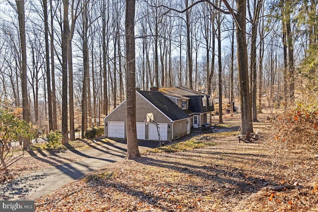 view of side of home with a garage