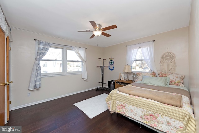 bedroom featuring dark hardwood / wood-style floors and ceiling fan