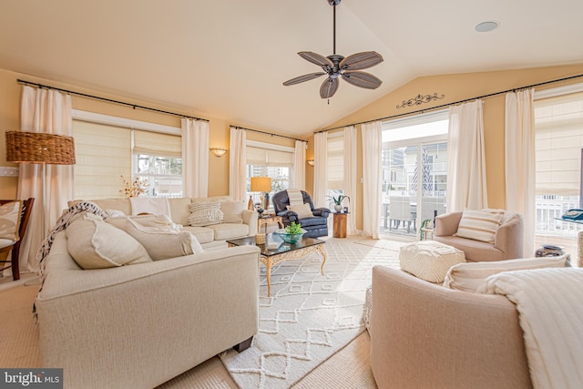 living room featuring ceiling fan and vaulted ceiling