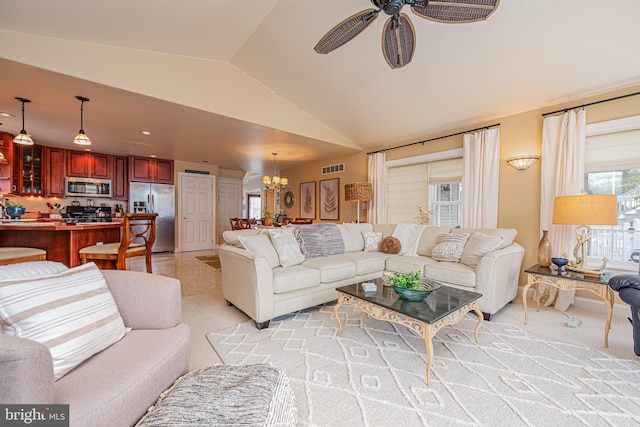 living room featuring vaulted ceiling, light carpet, and ceiling fan with notable chandelier