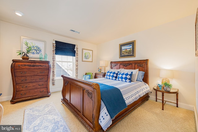 bedroom with light colored carpet