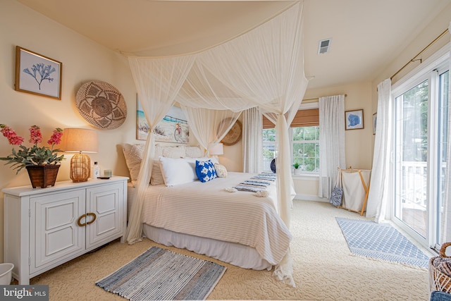 carpeted bedroom featuring access to outside