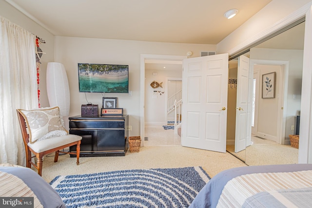 carpeted bedroom featuring a closet