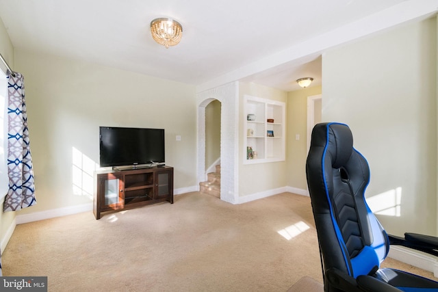 carpeted home office featuring built in features