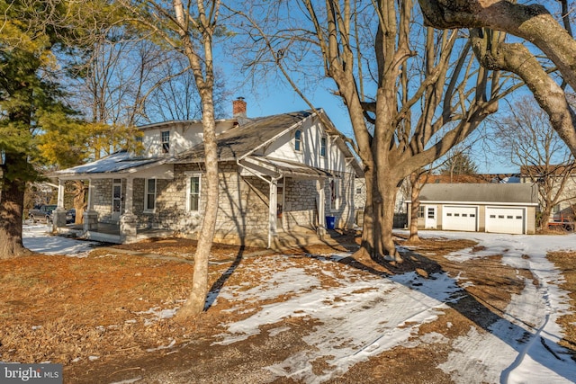 view of front of home featuring a garage and a porch