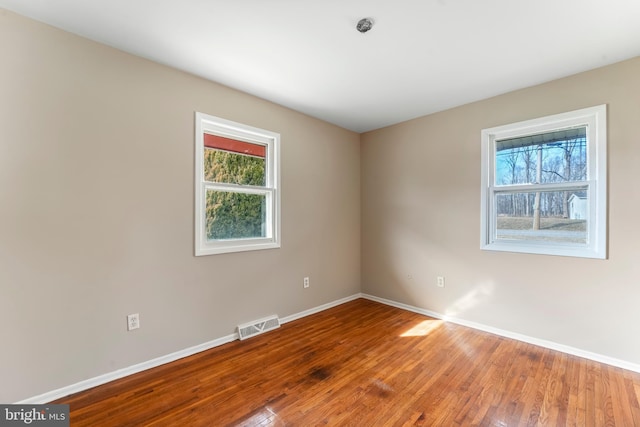 empty room with wood-type flooring