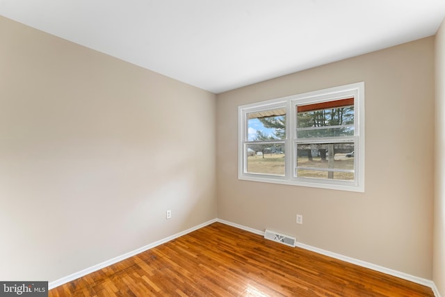 unfurnished room featuring wood-type flooring