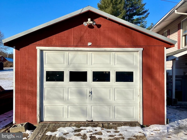 view of snow covered garage