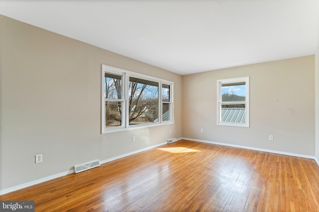 spare room with light wood-type flooring