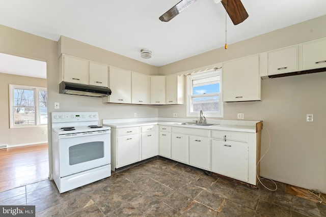 kitchen featuring white cabinetry, sink, white electric range, and ceiling fan