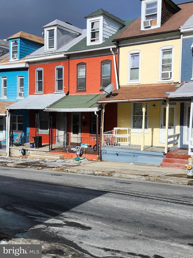 multi unit property featuring a porch