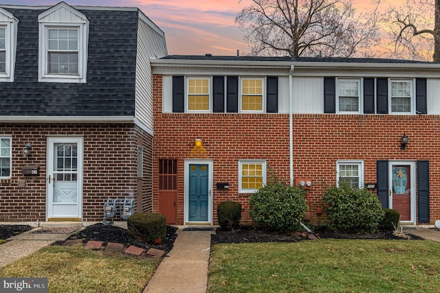 view of front of house with a yard