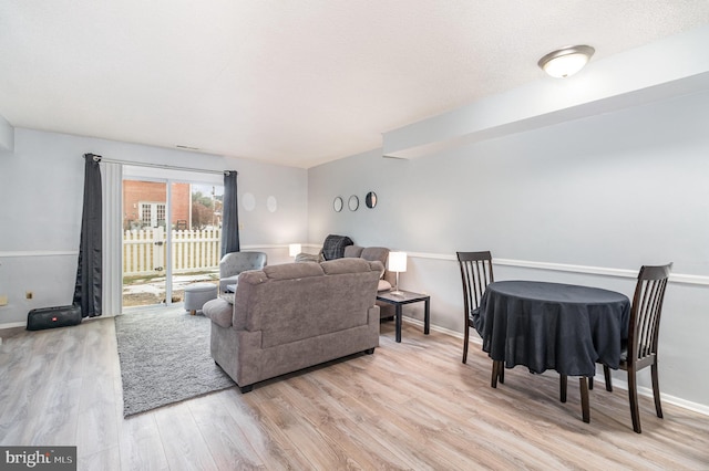 living room with light hardwood / wood-style floors