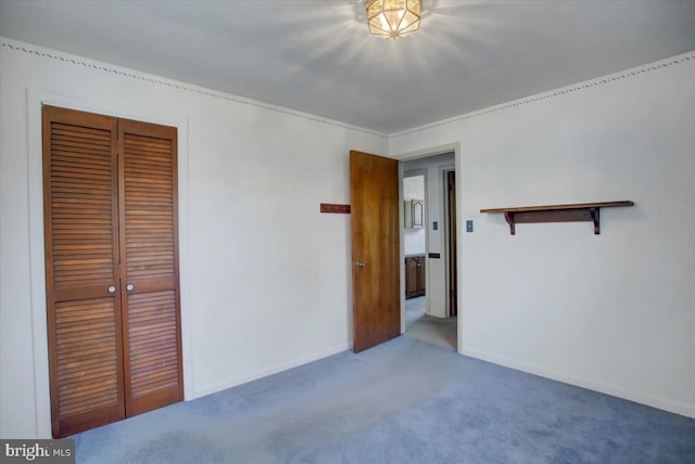 unfurnished bedroom with light carpet and a closet